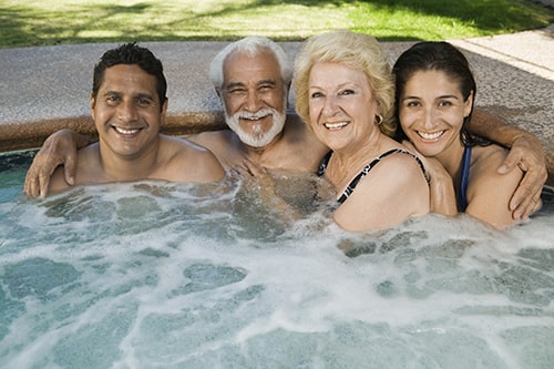 Family Smiling in Hot Tub